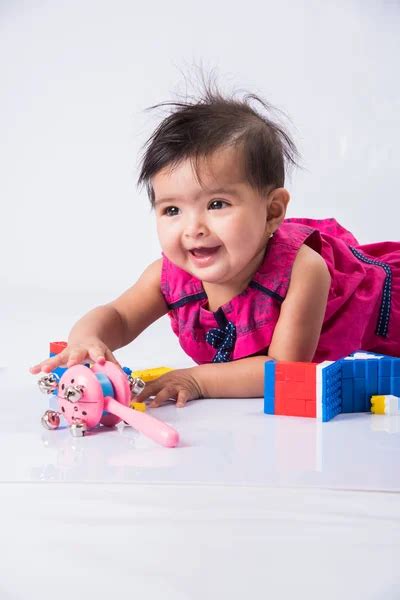 Girl Playing Toy On The Floor Stock Photo By ©parinyabinsuk 75253125