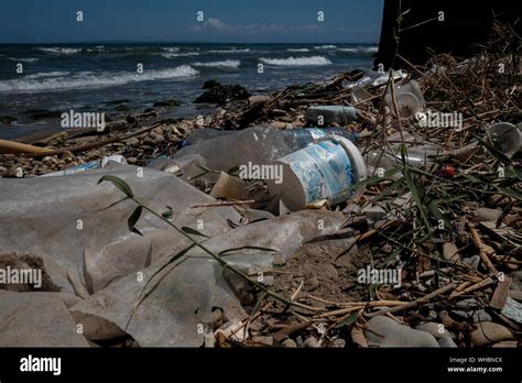 Plastic Waste Along The Shoreline Of Zakynthos Island Showing The