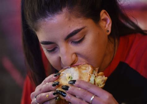 Competitive Eater Leah Shutkever Takes On A Burger Challenge At Holy