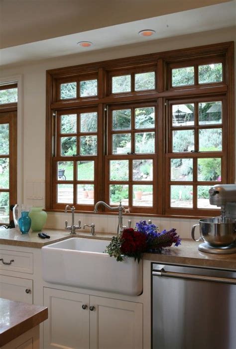 Open layout kitchen with white cabinets gray island cambria quartz. wood windows | Wood trim, Oak trim, Wood countertops kitchen