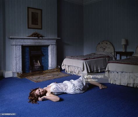 Young Woman Laying On Floor In Bedroom Photo Getty Images