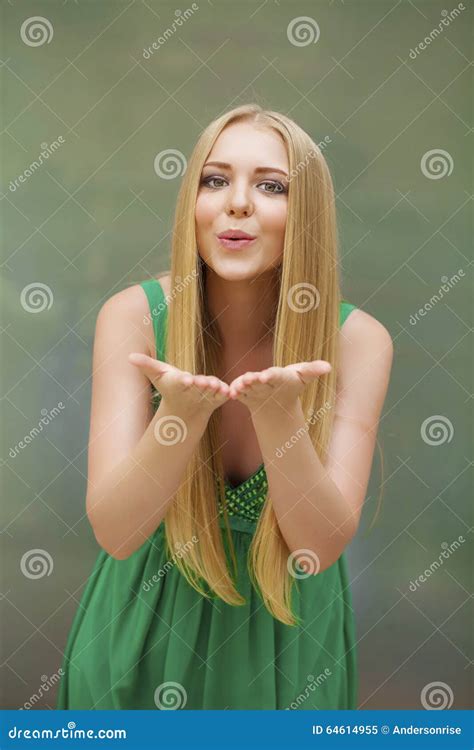 Young Blonde Woman Blowing While Sending An Air Kiss Stock Image Image Of Flirting Hair 64614955
