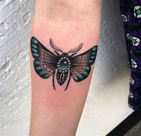 Without knowing the history of the moth in tattooing, they just seem to fit in that style of tattooing. Chris Stockings' Work