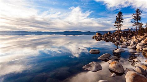 Wonderful Stone Shore Of A Mirror Lake High