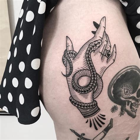 Serpent tattoo tattoo snake tigh tattoo dragon thigh tattoo side of thigh tattoo tattoo on hip snake and flowers tattoo side tattoos foot tattoos. Hand with a snake tattoo | Hand tattoos for women, Hand ...