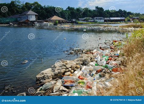 The Lake And The Shore Are Littered With Garbage Stock Photo Image Of