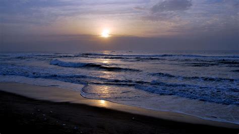 Beach Sea Waves During Sunset Under Black Blue Clouds Sky 4k Hd Nature