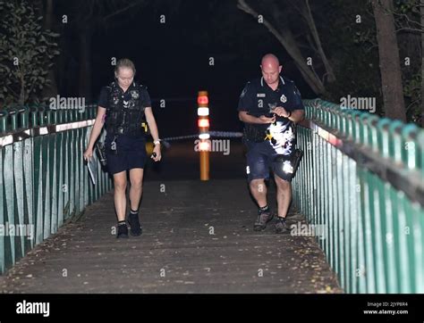 Queensland Police Officers Are Seen At The Scene Of A Shooting In The
