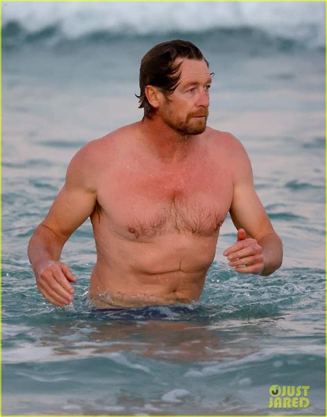 Simon Baker Goes For Dip In The Ocean While At The Beach With Son Harry