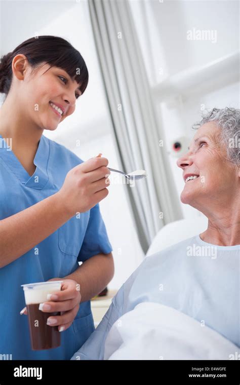Nurse Feeding A Patient Stock Photo Alamy