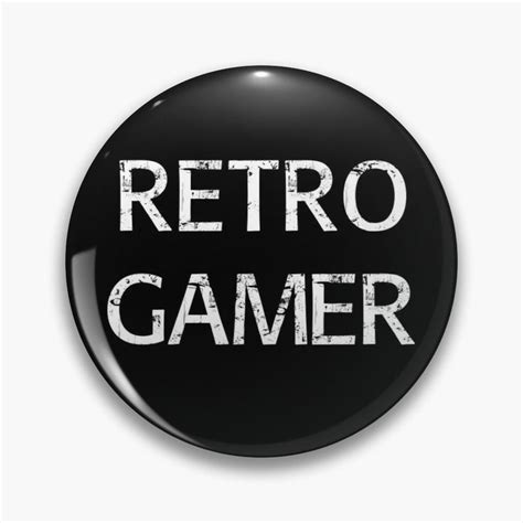 A Black Button With The Words Retro Gamer Printed In White On It
