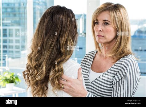 Sad Mother Holding Daughter Stock Photo Alamy