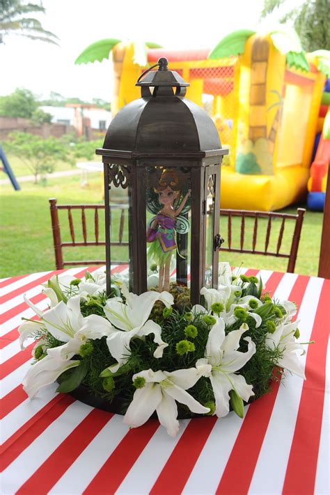 Hide pirate party favors around your celebration space or incorporate party games. Centerpiece guest table - Zarina Fairies and Pirates Birthday | Table decorations, Pirate ...