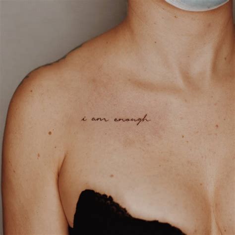 I Am Enough Lettering Tattoo On The Collarbone