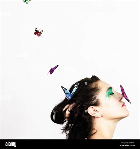 Woman With Butterfly On Her Nose Stock Photo Alamy