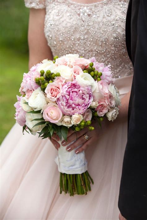Check out bouquet and boutonniere photos from some of our past central park weddings. Pink and Green Round Bridal Bouquet