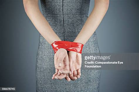 Woman Hands Tied Behind Back Photos And Premium High Res Pictures Getty Images