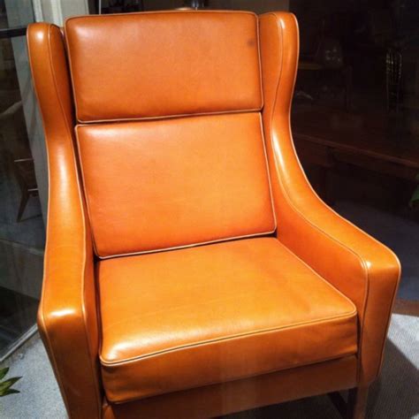 This accent chair offers a sophisticated upgrade to a traditional living room or study. Agent orange. | Armchair, Wingback chair, Accent chairs