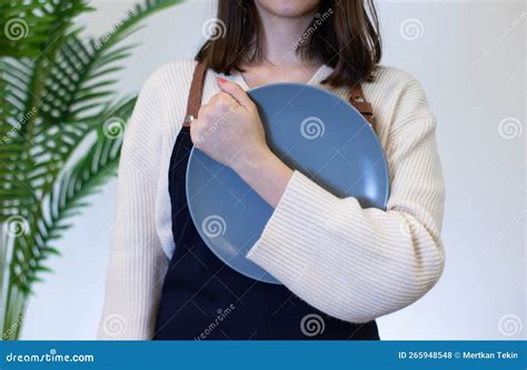 Woman Holding Porcelain Plate With Hand On White Background Stock