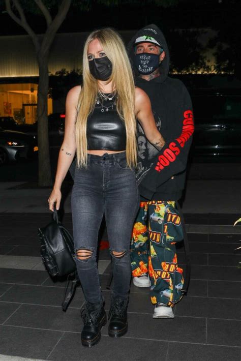 Avril Lavigne In A Black Outfit Arrives For Dinner At Boa Steakhouse With Mod Sun In West