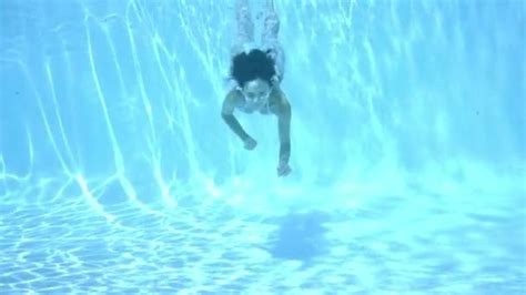 Girl In Bikini Swimming Underwater In Blue Pool Cinematic Slow Motion