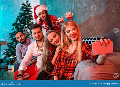 Friends Making Selfie While Celebrating Christmas Or New Year Eve At
