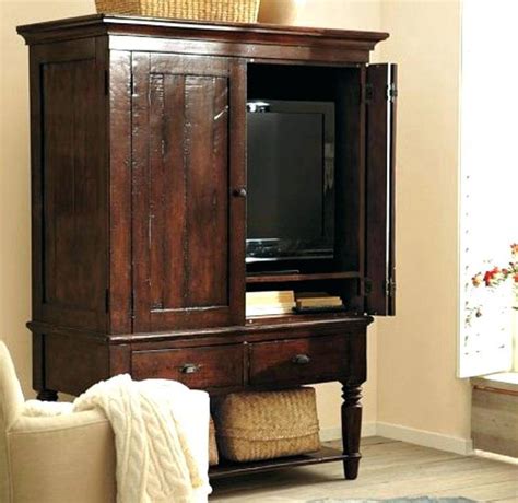 One of the questions to ask yourself is, do you want to display your tv or do you want to hide it away? Corner Tv Armoire With Pocket Doors