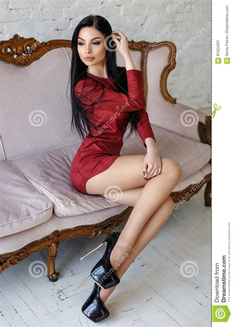 Sensual Woman With Perfect Body Posing In A Red Short Dress Stock Image