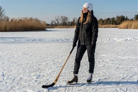 Woman In Skates With Hockey Stick On Frozen Lake Stock Image Everypixel