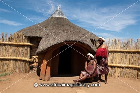 Photos And Pictures Of Basotho Women In Front Of Traditional Hut
