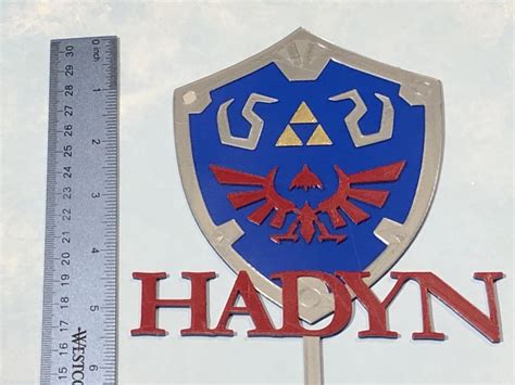 It's a slow burn to start, never so little going on that you're lacking for motivation, but also. Zelda Hylian Shield Personalized Birthday Cake Topper - 3D Wade Creations