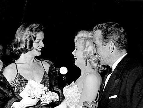 Marilyn Monroe Lauren Bacall And Humphrey Bogart Attend The Premiere Of How To Marry A