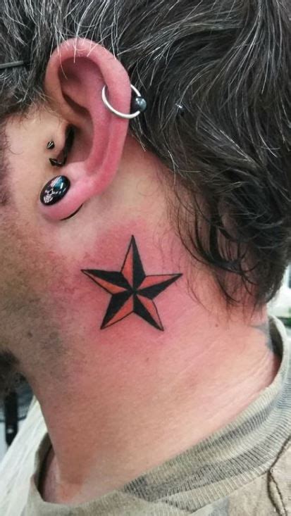 A Man With A Star Tattoo On His Ear