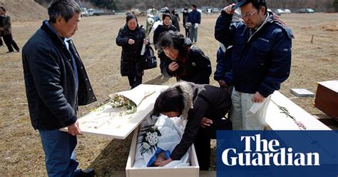 Japanese Evacuees And Funerals In Pictures World News The Guardian