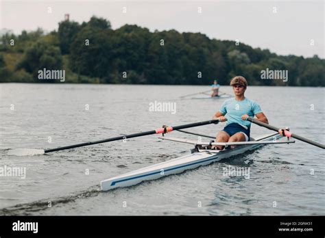 Sportsman Single Scull Man Rower Rowing On Boat At Lake River Stock