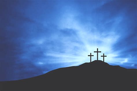 Christian Easter Crosses On Hill Of Calvary With Blue Clouds In Sky And