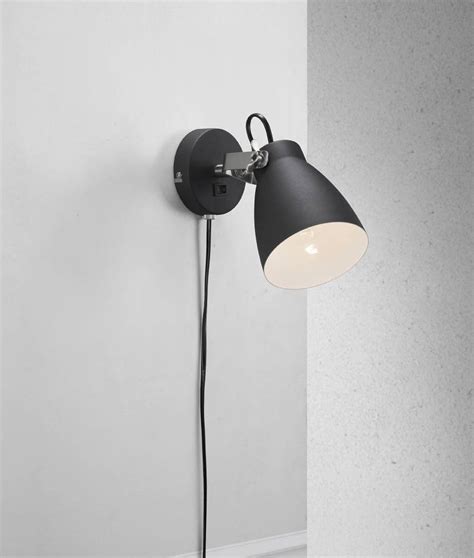 Featuring an embossed glass shade, the vela wall light emits a soft and comfortable light. Plugged Adjustable Metal Wall Light - Black or White