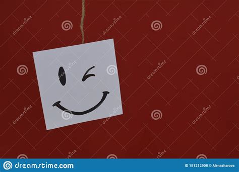 Happy Emoticon On A White Sheet Positive Thinking Concept Hiding