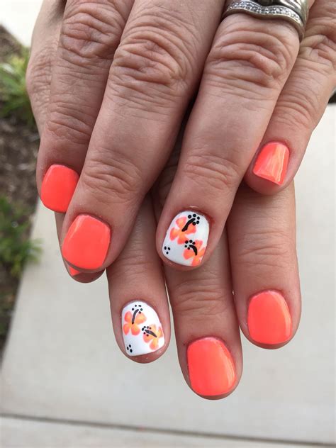 Bright Neon Orange Coral Gel Polish With Coral Hibiscus Flowers Over White Accent Nails Coral