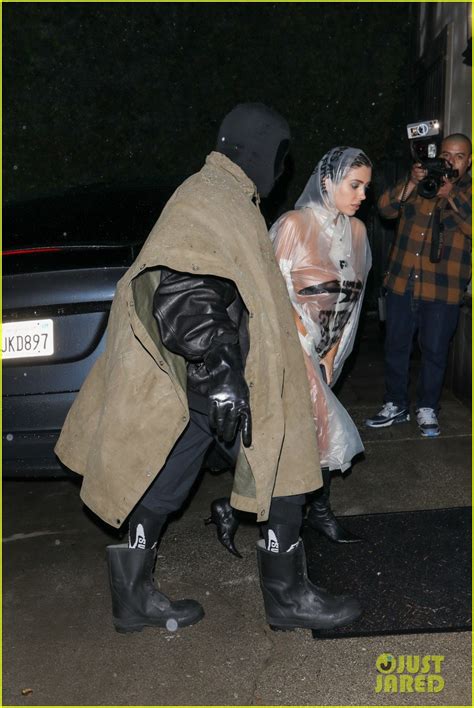 kanye west s wife bianca censori braves the rain in see through poncho with nothing underneath