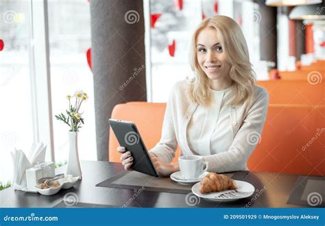 Beautiful Young Businesswoman Sit In Cafe With Laptop Netbook And Drink Coffee Stock Image