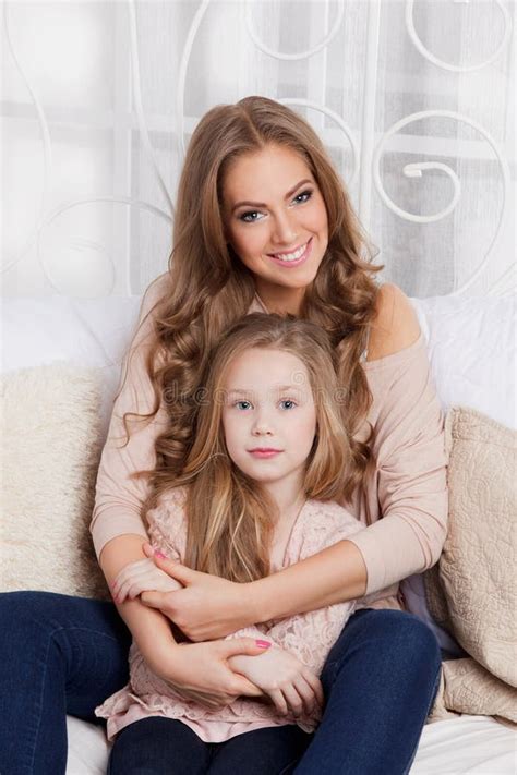 Pretty Mother Cuddling With Daughter Stock Image Image Of Attractive