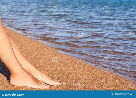 Beautiful Woman S Legs On The Beach Sand Stock Photo Image Of