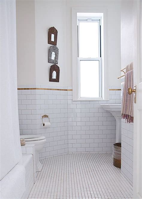 White bathroom floor tiles with small black insets can effectively ground the floor space, keeping it distinct from white walls. 30 white mosaic bathroom floor tile ideas and pictures
