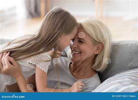 Cute Granddaughter Having Fun Playing With Grandmother Embracing Stock Image Image Of