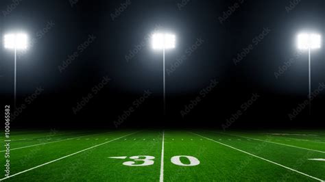 Football Field Illuminated By Stadium Lights Stock Photo Adobe Stock