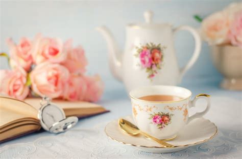 Premium Photo Cup Of Tea With Teapot And Flowers With Vintage Tone