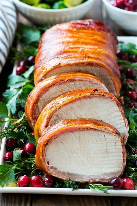 This bacon wrapped pork loin is so tender it can be cut with a fork. This bacon wrapped pork loin roast is brushed with a sweet ...