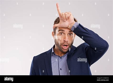 Loser Portrait Of A Man Making A Loser Gesture With His Hand Stock