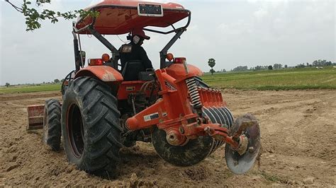 Powerful Kubota Tractor Pushing Soils In Dry Field Youtube